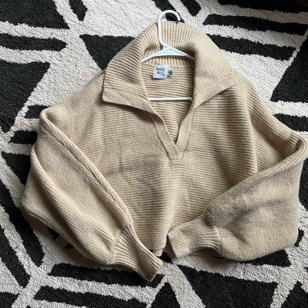 Tan sweater.